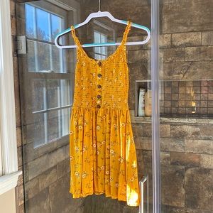 Mustard yellow floral summer dress.